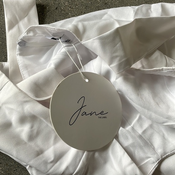 White, flared bottom, jumpsuit never worn - Picture 4 of 4